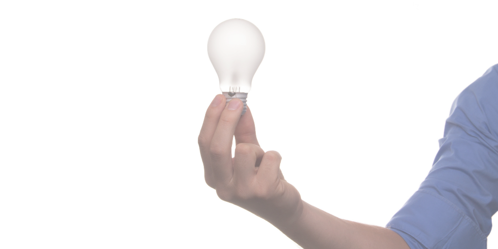 man holding lightbulb